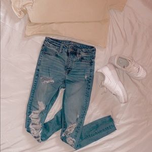 AE High rise blue jeans very holey